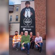 Gary Aspden, centre, with, from left, artists Peter Barker and Gary Watson, Nightsafe operations manager Nicola Roscoe, and service user Cole Hughes, in front of the mural