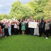 Representatives of six charities together with staff from Joseph Holt at recent presentation evening at The Woodthorpe pub in Prestwich.