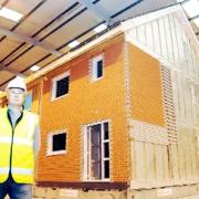 SAFE AS HOUSES: Pretek boss Peter Marshall inside the new giant works in Blackburn where pre-packed eco-friendly homes will be built