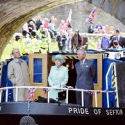 The Duke of Edinburgh, the Queen and Prince Charles on a canal boat in Burnley, during their 2012 visit.