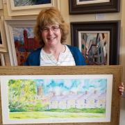 Artist Gillian Ousby with one of her paintings