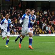 Blackburn Rovers' Bradley Dack celebrates scoring his side's first goal with Lewis Travis and Tyrhys Dolan
