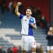 Rovers captain Lewis Travis celebrates at the final whistle