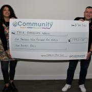 Si Donnelly accepting the Community CVS cheque of £1,992