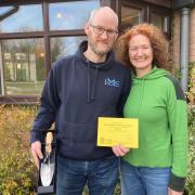 Gardeners Chris Whitaker-Webb and Joanne Smith with their award and engraved trowel