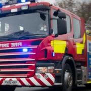 Crews spend more than an hour tackling vehicle fire
