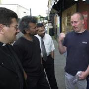 TALKS A multi-faith group on the streets discussing the aftermath of the Burnley riots in 2001