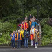 Some of the Bacup Pride volunteers with judge Imran Aslam at the Wall of History Gardens