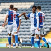 Niall Ennis celebrates after scoring his first Rovers goal