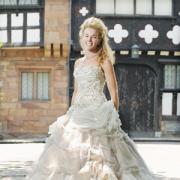 DRESS TO IMPRESS Nicola Wood outside Turton Tower which is now to host weddings. The dress was donated by Ninety One wedding shop, Bury. Picture: Robert Binder