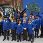 Headteacher Donna Simpson celebrates with pupils at Wensley Fold CE Primary Academy