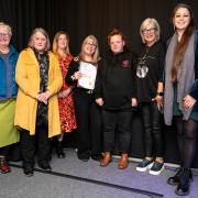 Bacup Family Centre winning a Special Recognition Certificate at Bacup Business Association Awards 2023, from left, volunteer Pat Smith, BBA awards compere Jane Pallister, Office Administrator Natasha Cartright, and  Project Manager Leila Allen