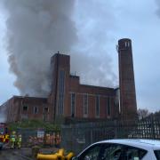 The fire involves a large building containing commercial waste