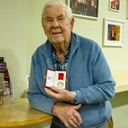 Geoff Sword with his British Empire Medal