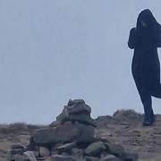 The brother and sister said they took pictures of the woman at the top of Pendle Hill