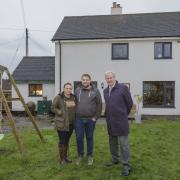 Stuart Hirst, chairman of Ribble Valley Borough Council's health and housing committee, with Ben and Beth Powney, who re-rendered their rural home and installed a new boiler, windows and doors, with the help of a first-time buyer grant.