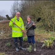 County Councillors Shaun Turner and Carlole Haythorntwaite get started on the spade work