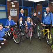 (Adults) L – Michelle Grimes, Project Lead at Active Cycles, C – Dr Amanda Thornton, Active Lancashire Board Lead for Health and Wellbeing, R – Mr Clough, Sports Coach at Brunshaw Primary School with students and their donated bikes from Active