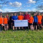 The Pendle Trail Runners donated £250 to the mountain rescue team