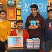 Blackburn’s Shabaz Ali posed with fans at a book signing in the Mall