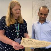 Blackburn with Darwen Council chief executive Denise Park and deputy director of legal and governance Asad Laher receive the official writ from King Charles