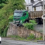 Pictures as lorry blocks road and smashes through railings in Billington
