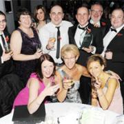 POWER SURGE Staff from Simply Electricals toast their success.