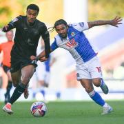 Tyrhys Dolan battles for possession