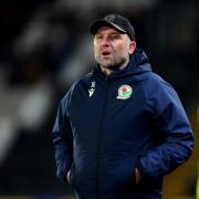 Rovers boss John Eustace looks on