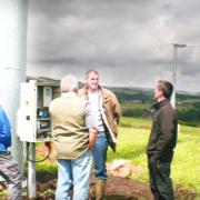 TOWERS Andy Paton, facing, talks turbines to other farmers