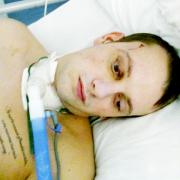 BATTERED Matthew Edgington in hospital after his attack while on a night out in Manchester