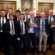 The Old Rossallians team celebrating their victory in the Halford Hewitt trophy room