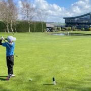 Seven-year-old Freddie Kellow teeing off