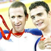 Steven Burke (right) and Bradley Wiggins show off their medals at the 2008 Olympics