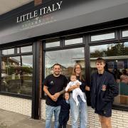 Fabio and Cara outside the new venue with their children Mia, Nico and Zac