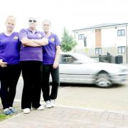 Community volunteers, from left, Katie Queen, Christine Connell and Katrina Queen are concerned about speed