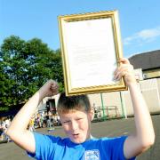 Charlie Warrender with his letter from the Queen