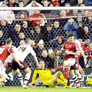 Tom Heaton makes a late save in the draw at Nottingham Forest