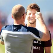 England’s Adam Lallana gets a cool down during a training session