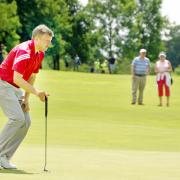 Mark Young lines up at putt at Clitheroe