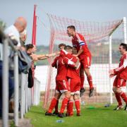 DELIGHT: AFC Darwen’s Paul Coote celebrates scoring his side’s second goal against AFC Liverpool