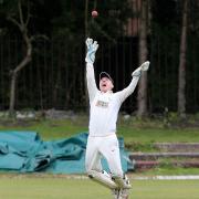 AIMING HIGH: Burnley wicketkeeper Chris Burton can’t quite take a catch as the Turf Moor men lost to Lowerhouse on Sunday Picture KIPAX