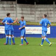 PICK ME UP: Padiham players celebrate Kieron Pickup’s first goal Pictures: HELEN BROWN