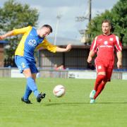 UPWARD CURVE: Barnoldswick Town, seen here attacking in blue and yellow, have enjoyed a strong start to the season