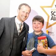 Russell Dawson presents the Primary School Pupil of the Year Award to Owen Sharples