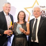 From left, Joe Makepeace, Jacqui Young and M.C. Bob Williams. Jacqui won Primary Head Teacher of the Year.