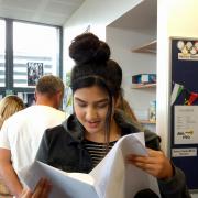 GCSE results day at Rhyddings Business and Enterprise College. Priya Patel scans her grades - all good news.