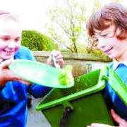 WASTE BUSTERS: Lucy and Charlie fill up one of the waste food bins