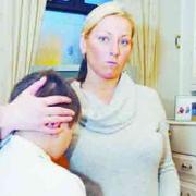 ANGRY: Lisa Coote with her injured son Jack