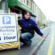 PETITION: Roz Connor, of Bloomin’ Lovely, with her home-made sign